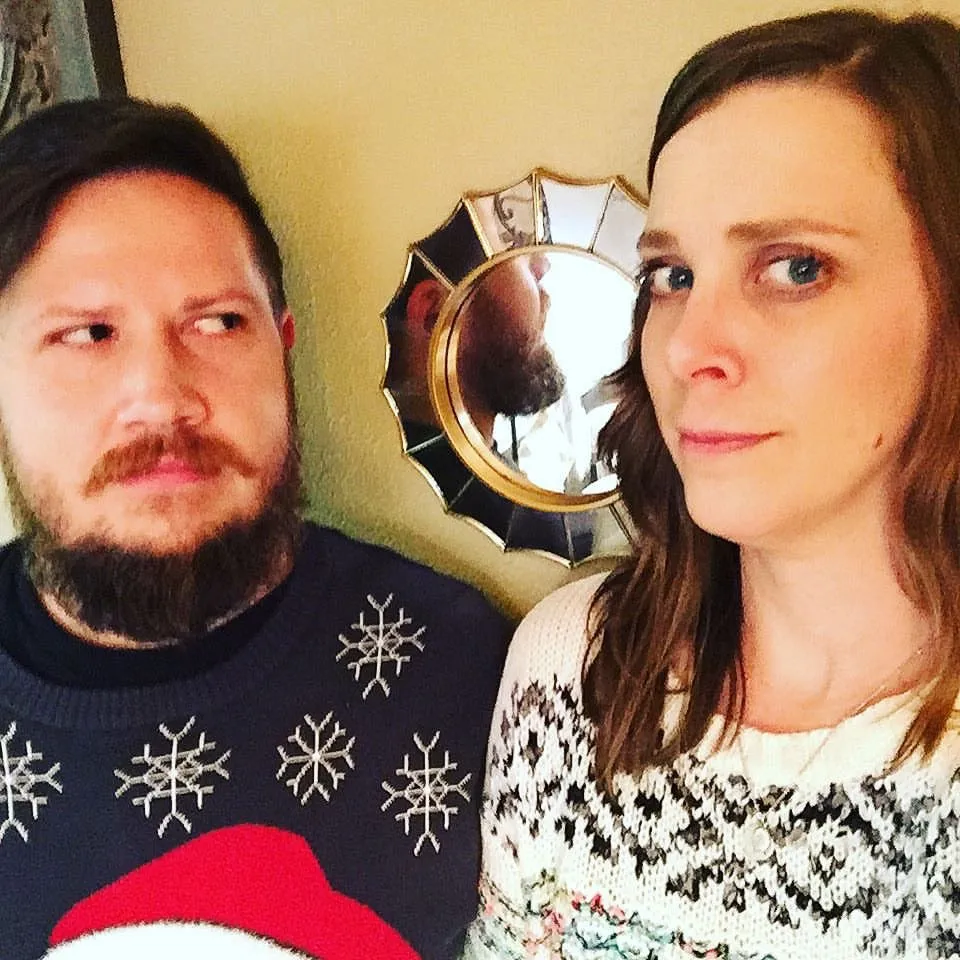 Us in snowflake sweaters giving each other the side-eye