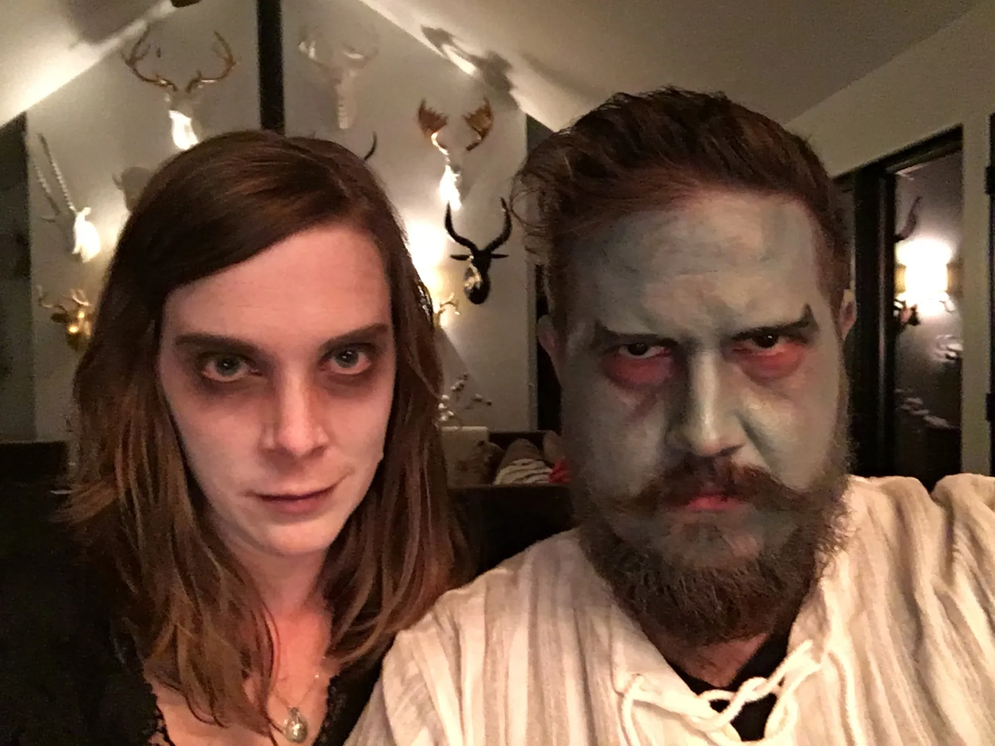 Us made up as the undead, glaring at the camera